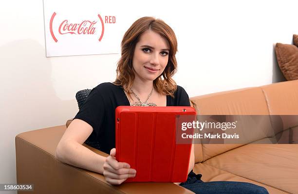 Actress Emma Roberts plays , a mobile game from The Coca-Cola Company and to help deliver an AIDS FREE GENERATION on December 20, 2012 in Los...