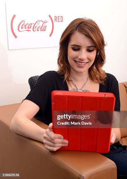 Actress Emma Roberts plays , a mobile game from The Coca-Cola Company and to help deliver an AIDS FREE GENERATION on December 20, 2012 in Los...