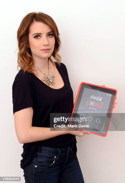 Actress Emma Roberts plays , a mobile game from The Coca-Cola Company and to help deliver an AIDS FREE GENERATION on December 20, 2012 in Los...