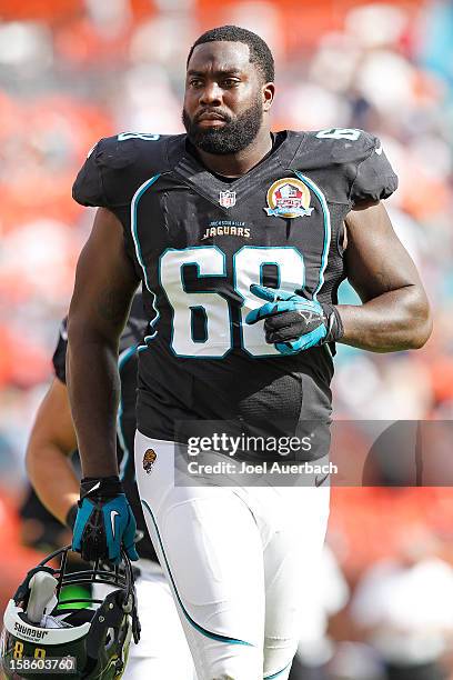 Guy Whimper of the Jacksonville Jaguars walks off the field for half-time against the Miami Dolphins on December 16, 2012 at Sun Life Stadium in...