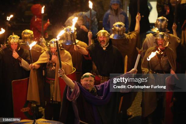 Re-enactors from the Roman Deva Victrix 20th Legion parade through the city of Chester as they celebrate the ancient Roman festival of Saturnalia on...