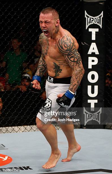 Ross Pearson reacts after knocking out George Sotiropoulos during their lightweight fight at the UFC on FX event on December 15, 2012 at Gold Coast...