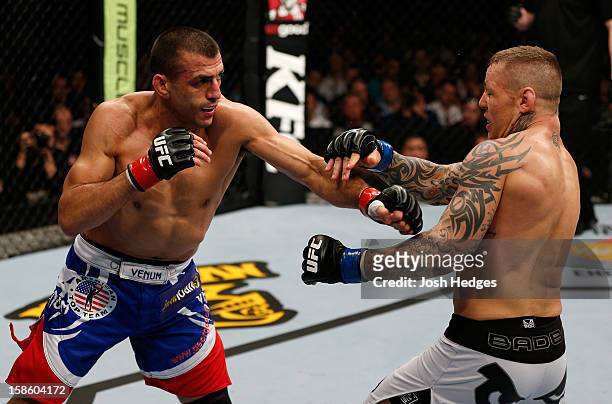 Ross Pearson punches George Sotiropoulos during their lightweight fight at the UFC on FX event on December 15, 2012 at Gold Coast Convention and...