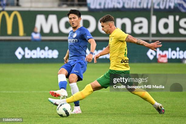 Tsuyoshi Watanabe of AA Gent battles for the ball with David uris of MSK Zilina during the UEFA Europa Conference League season 2023 - 2024, second...