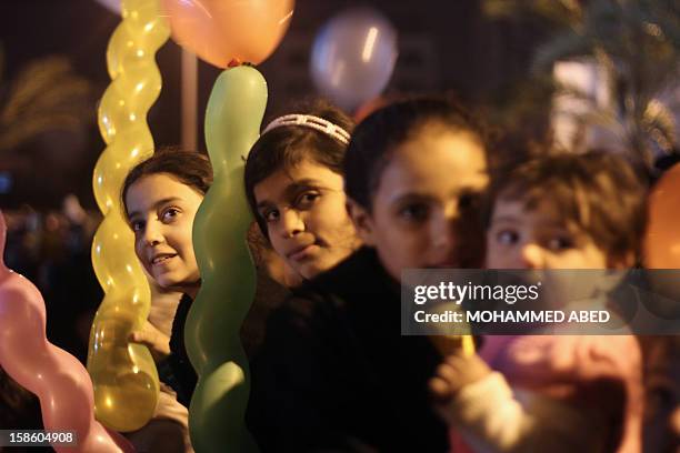 Palestinian children attend a festival of songs organized by the Islamic band 'Birds of Paradise' in Gaza City on December 20, 2012. The Hamas...