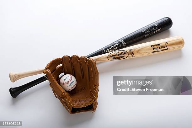 Detail shot of Louisville Slugger Bats, Rawlins Ball, and Wilson A2000 glove, the Official Bat, Ball and Glove of Major League Baseball, photographed...