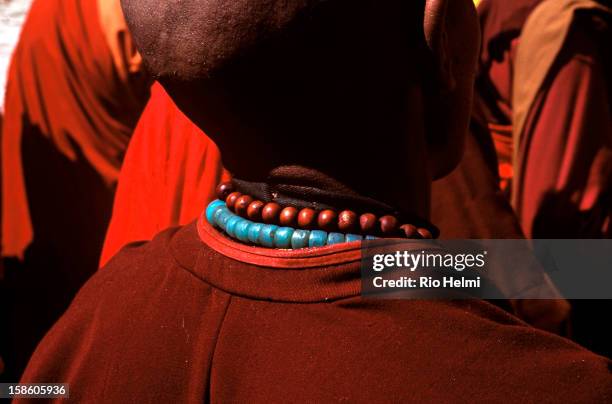 The 'mala' rosary beads of a monk attending a religious ceremony at the Ganden Hiid temple in Ulan Bator..
