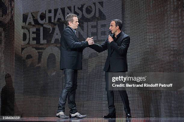 Singer Garou and TV host Nikos Aliagas attend 'La Chanson De L'Annee 2012' Show Recording at Palais des Sports on December 10, 2012 in Paris, France.