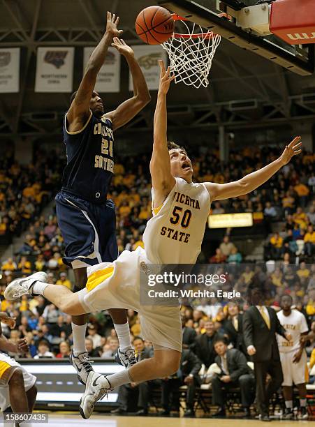 Wichita State's Jake White is fouled by Charleston Southern's Cedrick Bowen during the second half at Charles Koch Arena on Thursday, December 20 in...