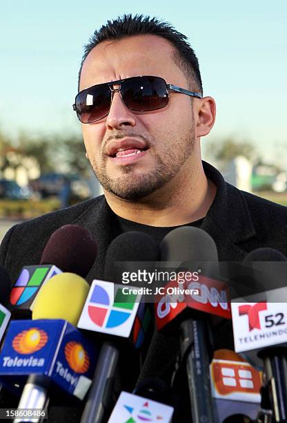 Singer Juan Rivera speaks outside All Souls Cemetery on December 20, 2012 in Long Beach, California, United States.