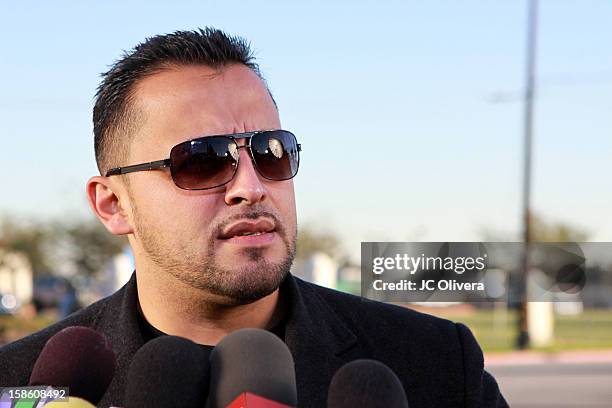 Singer Juan Rivera speaks outside All Souls Cemetery on December 20, 2012 in Long Beach, California, United States.