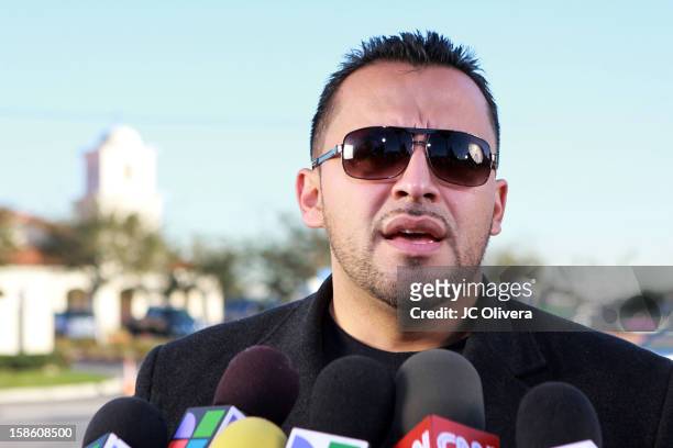 Singer Juan Rivera speaks outside All Souls Cemetery on December 20, 2012 in Long Beach, California, United States.