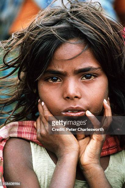 Girl waits to be evacuated from one of the low-lying islands off Cox's Bazaar after the biggest cyclone in recent decades completely laid waste to...