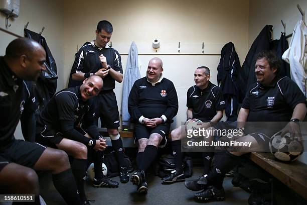 The referees enjoy some banter before their matches at Hackney Marshes on October 14, 2012 in London, England. Hackney Marshes in east London has...