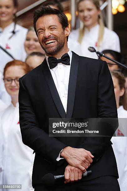 Hugh Jackman shares a joke on the red carpet with Russell Crowe during the Australian premiere of 'Les Miserables' at the State Theatre on December...