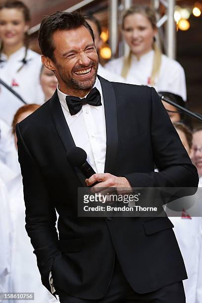 Hugh Jackman shares a joke on the red carpet with Russell Crowe during the Australian premiere of 'Les Miserables' at the State Theatre on December...