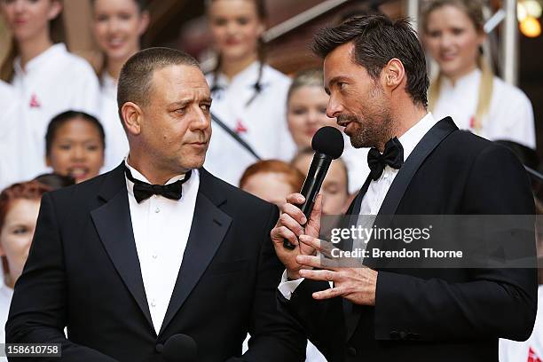 Hugh Jackman and Russell Crowe share a joke on the red carpet during the Australian premiere of 'Les Miserables' at the State Theatre on December 21,...