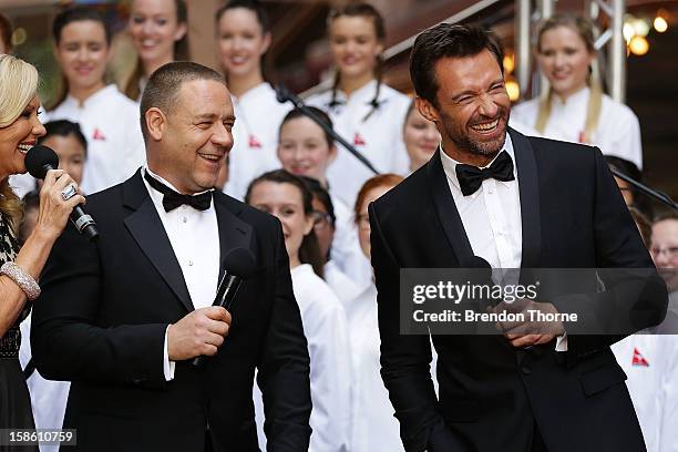 Hugh Jackman and Russell Crowe share a joke on the red carpet during the Australian premiere of 'Les Miserables' at the State Theatre on December 21,...