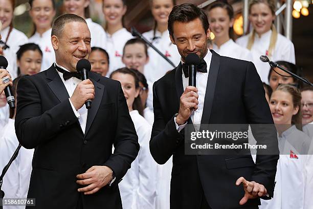 Hugh Jackman and Russell Crowe share a joke on the red carpet during the Australian premiere of 'Les Miserables' at the State Theatre on December 21,...