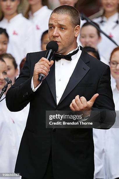 Russell Crowe shares a joke on the red carpet with Hugh Jackman during the Australian premiere of 'Les Miserables' at the State Theatre on December...