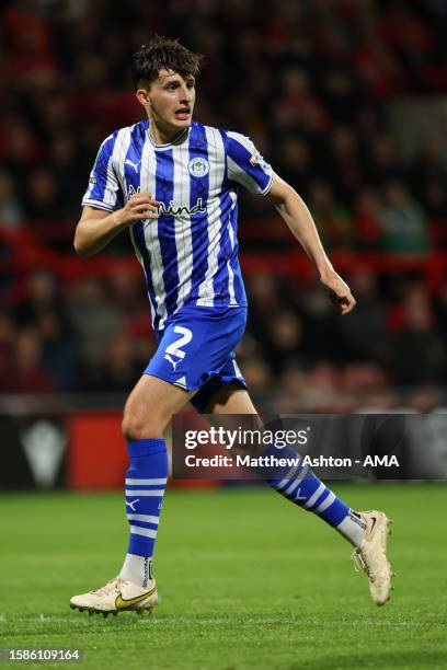 Kelland Watts of Wigan Athletic during the Carabao Cup First Round match between Wrexham and Wigan Athletic at Racecourse Ground on August 8, 2023 in...