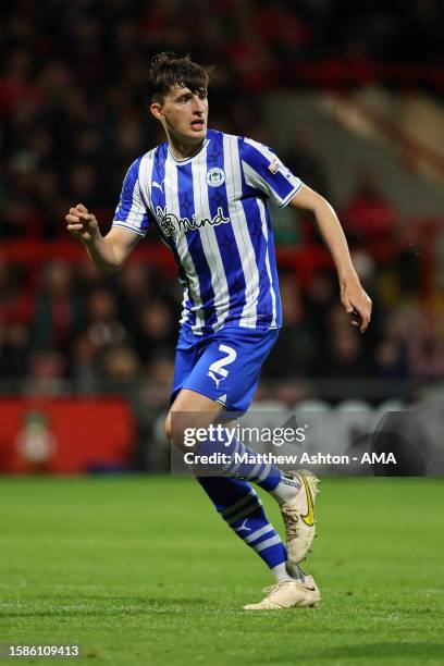 Kelland Watts of Wigan Athletic during the Carabao Cup First Round match between Wrexham and Wigan Athletic at Racecourse Ground on August 8, 2023 in...