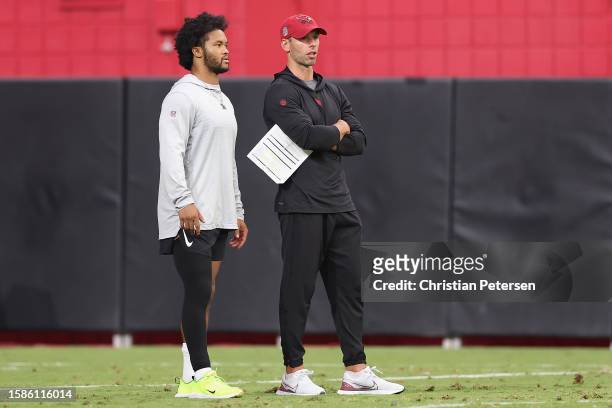Quarterback Kyler Murray and head coach Jonathan Gannon of the Arizona Cardinals participate in a team practice ahead of the NFL season at State Farm...