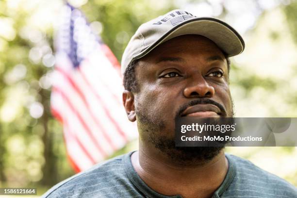 portrait of u.s. military veteran in front of home - national guard stock pictures, royalty-free photos & images