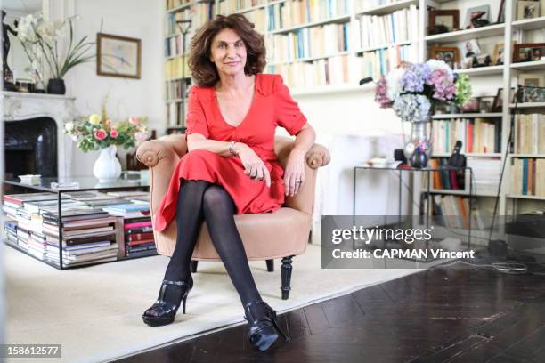 French television producer Fabienne Servan-Schreiber poses for a portrait at her home on October 19, 2012 in Paris,France.