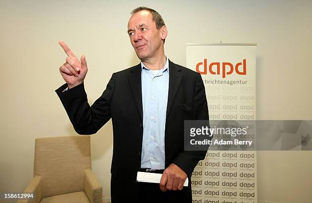 Ulrich Ende, dapd news agency investor and former CEO of NTV N24 television, leaves leaves a news conference on December 21, 2012 in Berlin, Germany....