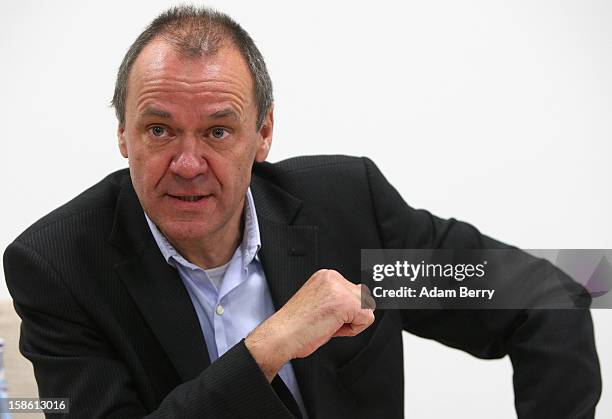 Ulrich Ende, dapd news agency investor and former CEO of NTV N24 television, leaves attends a press conference on December 21, 2012 in Berlin,...