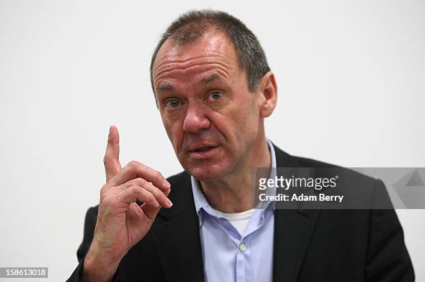 Ulrich Ende, dapd news agency investor and former CEO of NTV N24 television, leaves attends a press conference on December 21, 2012 in Berlin,...