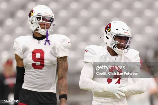 Budda Baker and Isaiah Simmons of the Arizona Cardinals participate in a team practice ahead of the NFL season at State Farm Stadium on August 01,...