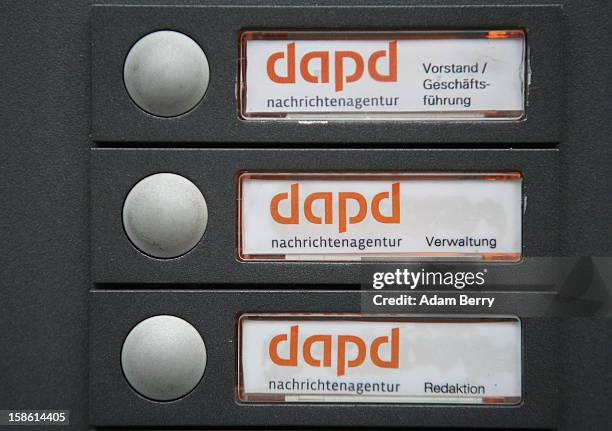 Door buzzers are seen at the headquarters of the dapd news agency on December 21, 2012 in Berlin, Germany. The financial newswire Dow Jones is to...