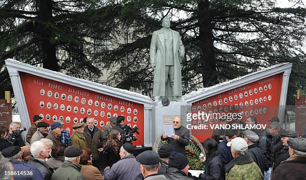 Man speaks at a rebuilt statue of Soviet dictator Joseph Stalin in the Georgian village of Alvani, on December 21, 2012. The statue went back up...