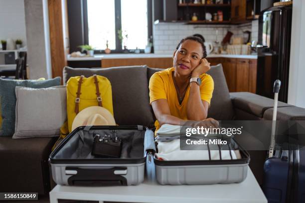 female solo traveler thinking about next travel destination - project traveller stock pictures, royalty-free photos & images