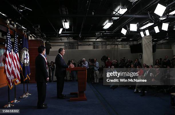 Speaker of the House John Boehner speaks during a press conference as House Majority Leader Eric Cantor looks on at the U.S. Capitol December 21,...