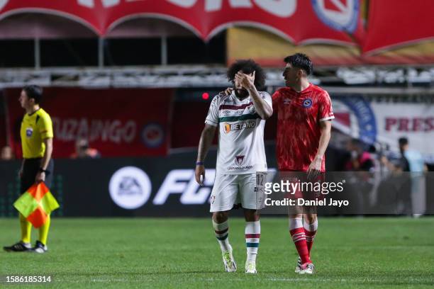 Marcelo of Fluminense cries after the injury of Luciano Sanchez of Argentinos Juniors during the Copa CONMEBOL Libertadores round of 16 match between...