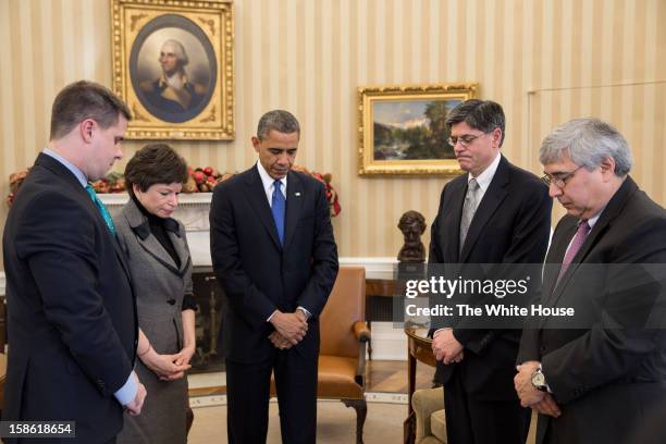 In this handout from the White House, President Barack Obama pauses during a meeting with Director of Communications Dan Pfeiffer, Senior Advisor...