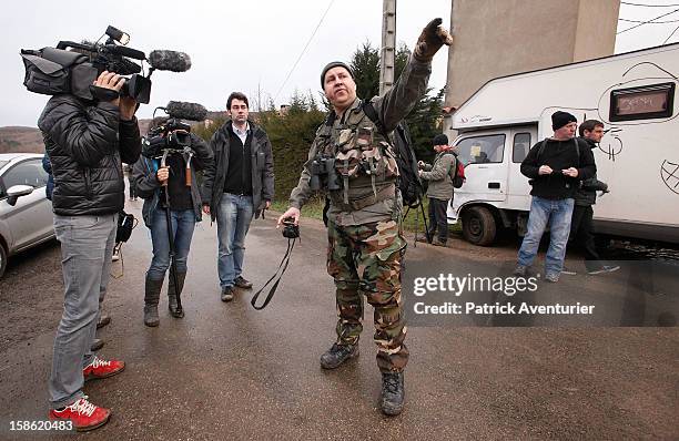 Media interview a man wearing camouflage clothing in Bugarach village on December 21, 2012 in Bugarach, France. The prophecy of an ancient Mayan...