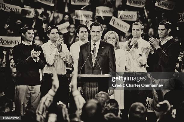 Republican presidential candidate and former Massachusetts Gov. Mitt Romney speaks during his primary night rally with members of his family, Matt,...