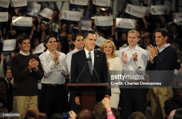 Republican presidential candidate and former Massachusetts Gov. Mitt Romney speaks during his primary night rally with members of his family, Matt,...