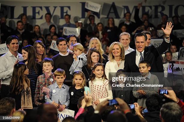 Republican presidential candidate and former Massachusetts Gov. Mitt Romney speaks during his primary night rally with members of his family, Matt,...