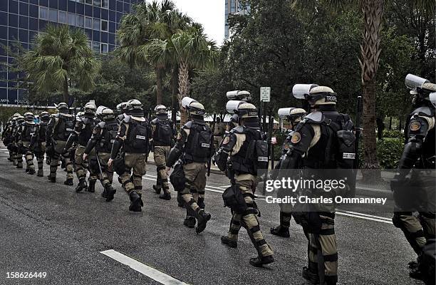 Law enforcement officers take their positions as activists demonstrate during a planned march on August 27, 2012 in Tampa, Florida. The demonstration...