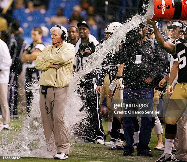 Defensive lineman Troy Davis nearly misses head coach George O'Leary with an attempted Gatorade bath after defeating Ball State, 38-17, in the Beef...