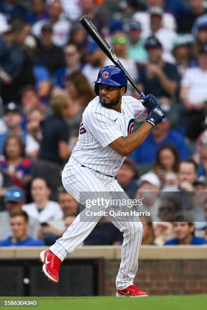 Jeimer Candelario of the Chicago Cubs hits a single in the first inning against Ben Lively of the Cincinnati Reds at Wrigley Field on August 01, 2023...