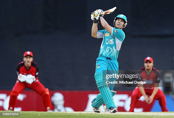 Luke Pomersbach of the Brisbane Heat hits ball for six off the bowling of Will Sheridan of the Melbourne Renegades during the Big Bash League match...