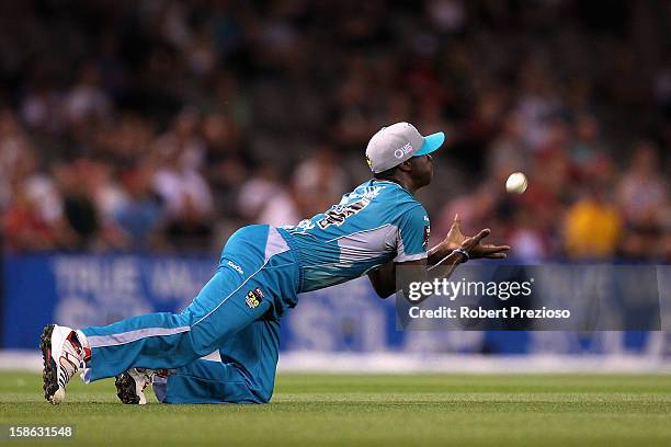 Kemar Roach of the Heat takes a catch to dismiss Aaron Finch of the Renegades off the bowling of James Hopes of the Heat during the Big Bash League...