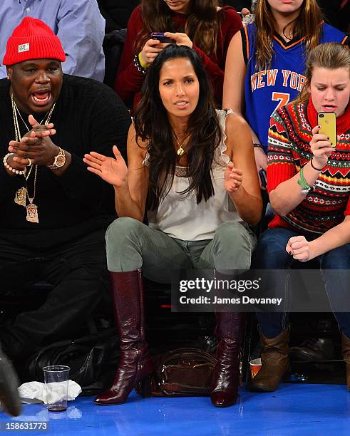 Padma Lakshmi and guest attend the Chicago Bulls vs New York Knicks game at Madison Square Garden on December 21, 2012 in New York City.