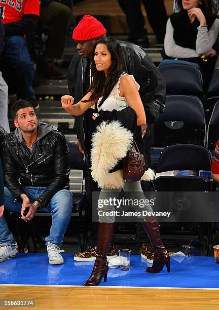 Padma Lakshmi and guest attend the Chicago Bulls vs New York Knicks game at Madison Square Garden on December 21, 2012 in New York City.